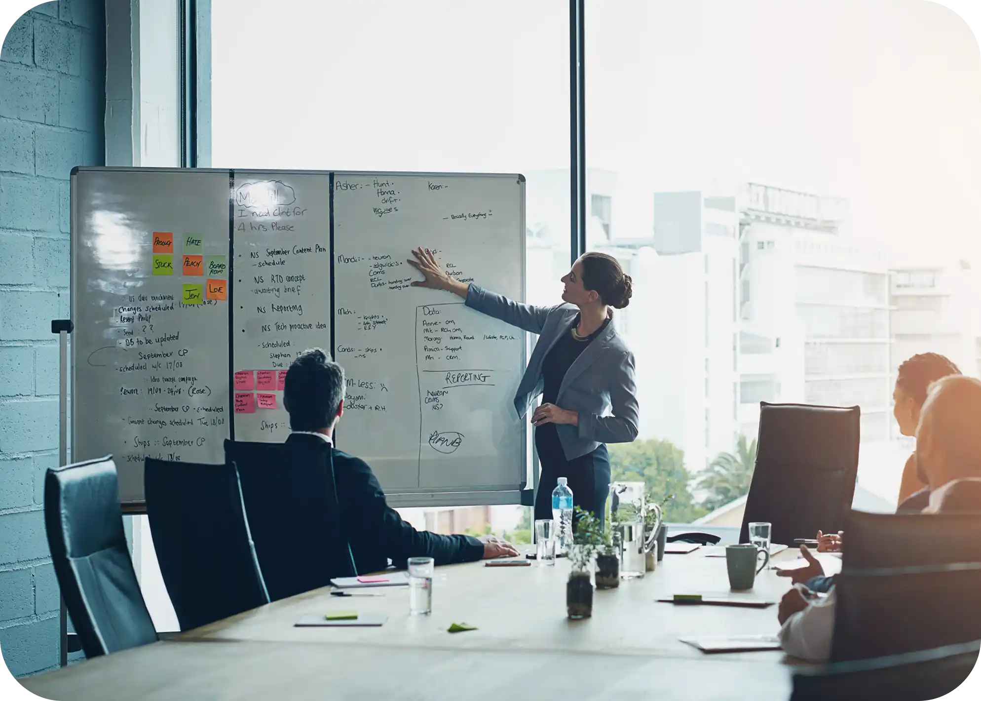 business-meeting-whiteboard-woman-speaker-with-presentation-office-planning-schedule-project-management-leadership-coaching-manager-hand-pointing-objectives-note-priority 1